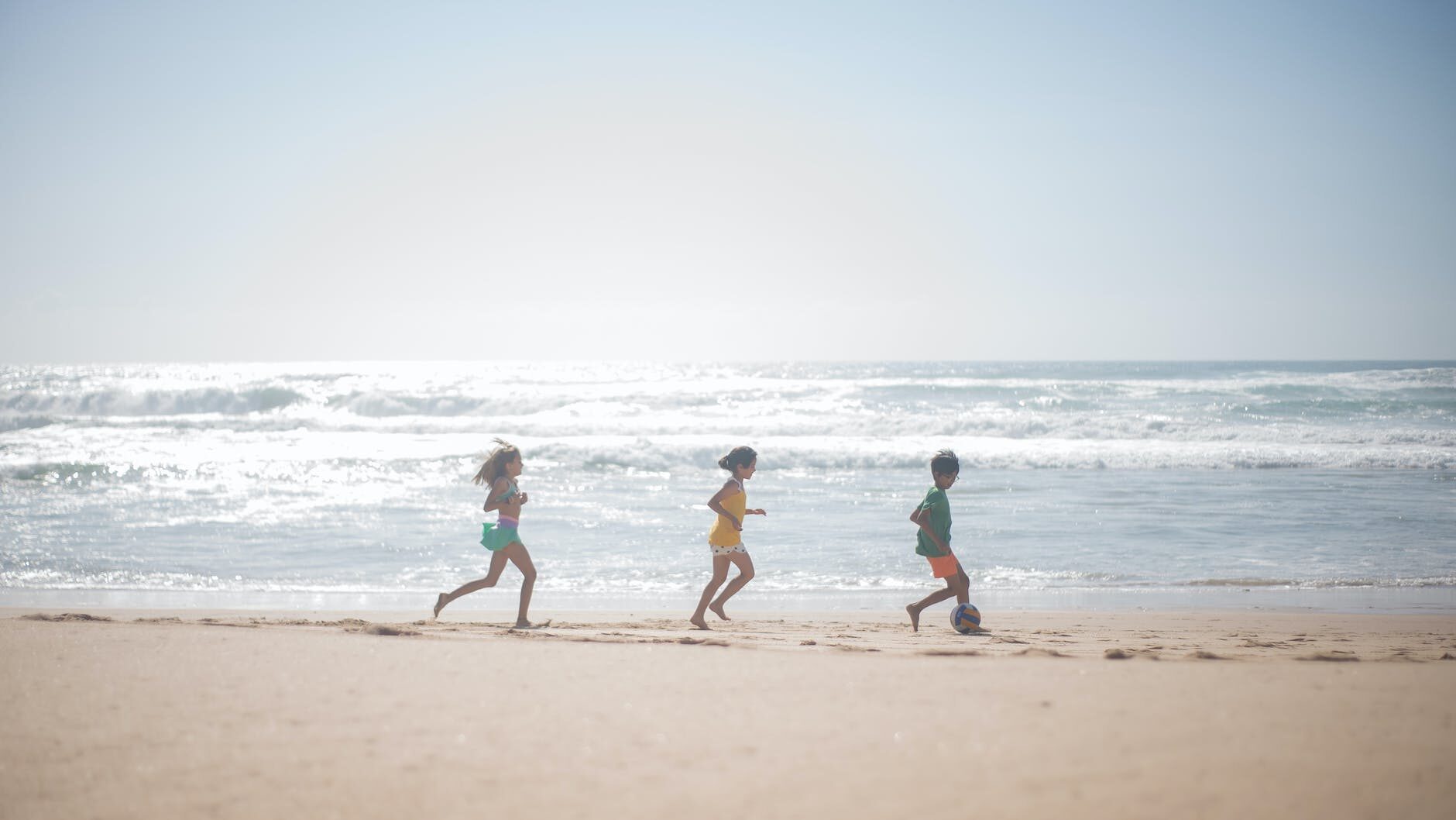 kids playing on the beach