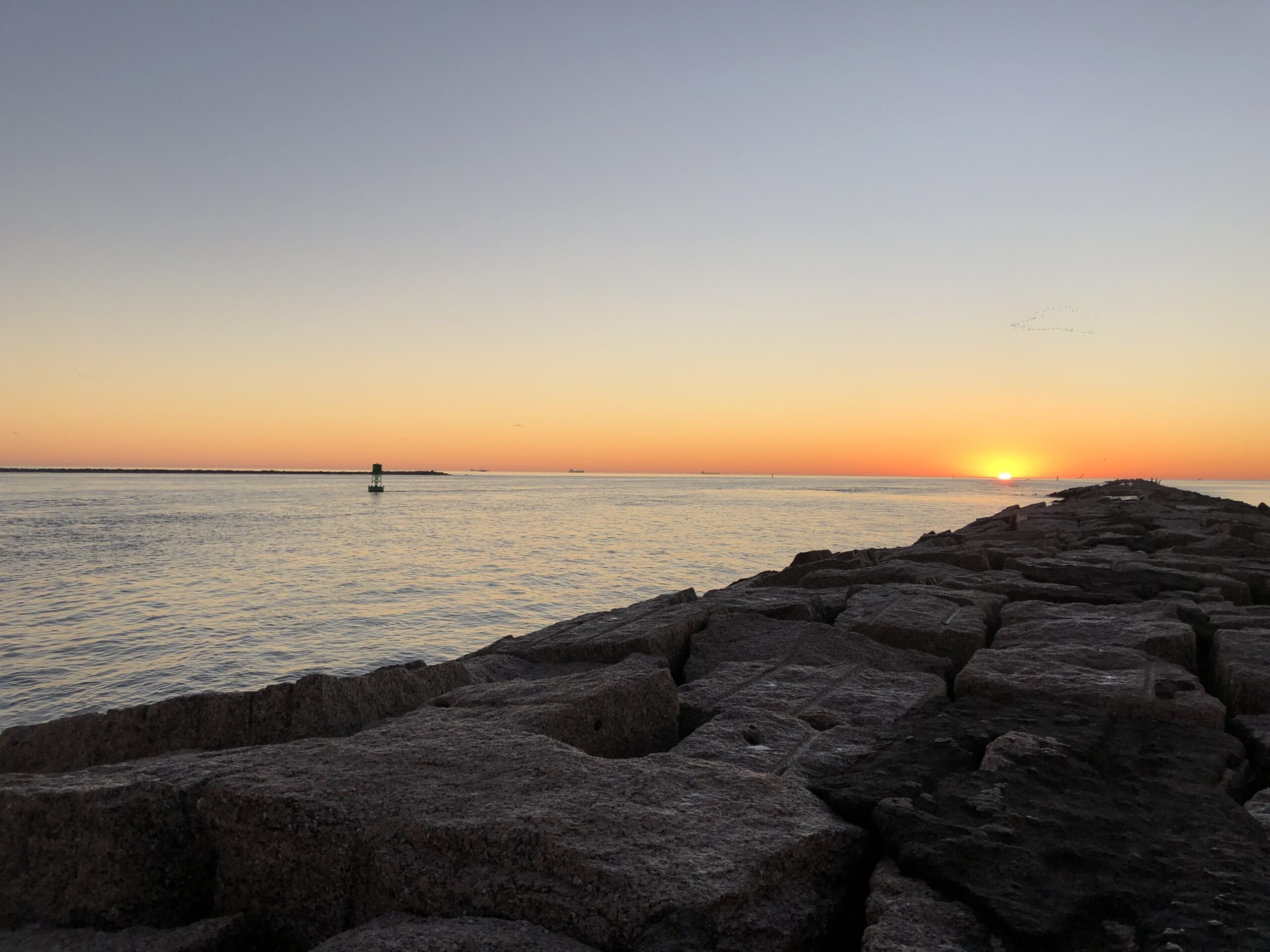 sunrise over the jetty | Port Aransas Explorer
