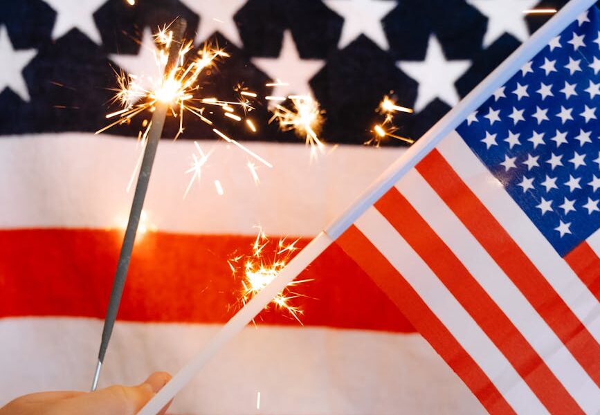 sparklers and american flag in hand | Port Aransas Explorer