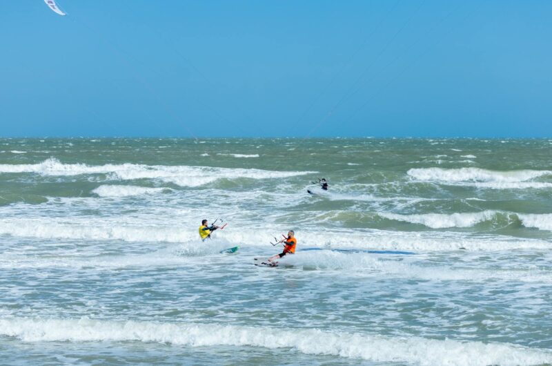 kitesurfing people on the sea