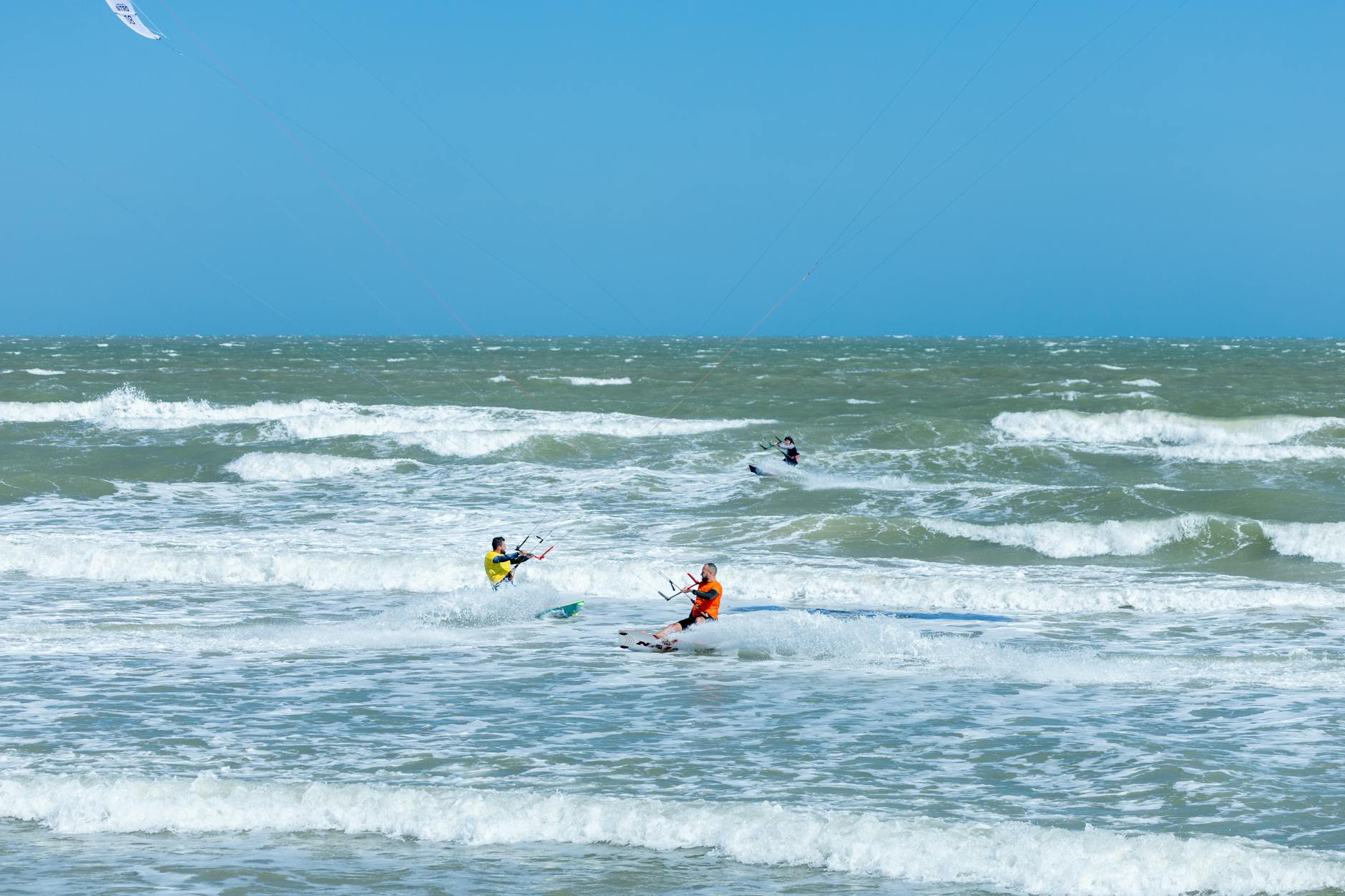 kitesurfing people on the sea